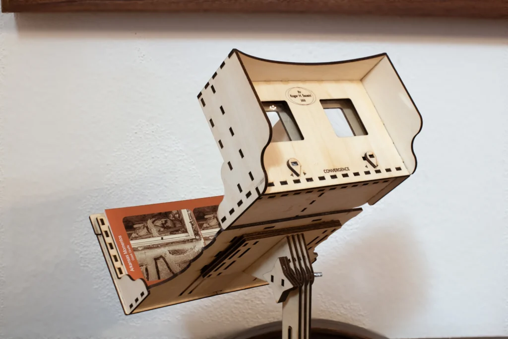 Wooden stereoscope viewer displaying the Arkansas Momentos stereo card, Ozark Giraffe at Mount Sequoyah exhibition